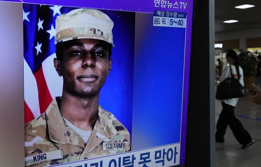 A TV screen shows a file image of American soldier Travis King during a news program at the Seoul Railway Station in Seoul, South Korea, Monday, July 24, 2023. The deputy commander of the U.N. Command ...