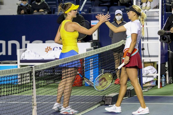 Elina Svitolina of Ukraine, left, and Anastasia Potapova of Russia shake hands after their match at the Abierto de Monterrey tennis tournament in Monterrey, Mexico, Tuesday, March 1, 2022. (AP Photo)