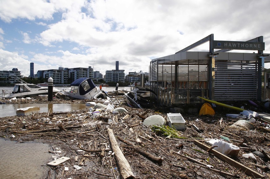 Wreckage is seen at the Hawthorne ferry terminal on the Brisbane river, Australia, Tuesday, March 1, 2022. Tens of thousands of people had been ordered to evacuate their homes and many more had been t ...