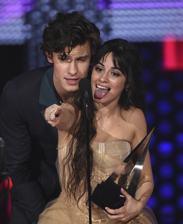 Shawn Mendes, left, and Camila Cabello accept the award for collaboration of the year for &amp;quot;Señorita&amp;quot; at the American Music Awards on Sunday, Nov. 24, 2019, at the Microsoft Theater i ...