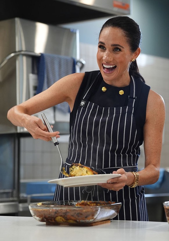 MELBOURNE, AUSTRALIA - APRIL 14: Meghan, Duchess of Sussex serves lunch at McAuley Community Services for Women, a women's homeless and family violence shelter, on April 14, 2026 in the Footscray ...