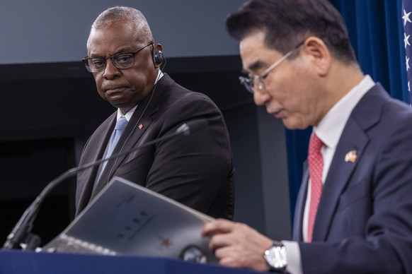 epaselect epa11692844 US Secretary of Defense Lloyd Austin (L) looks on as South Korean Defense Minister Kim Yong Hyun (R), delivers remarks during a joint press conference with at the Pentagon in Arl ...
