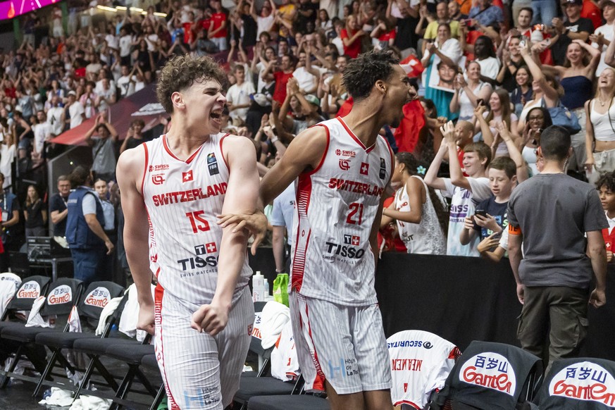 Switzerland&#039;s Andrin Njock, left, and Switzerland&#039;s Kamary Diakite, right, reacts after the victory during the Round of 16 FIBA U19 Basketball World Cup 2025 between Switzerland and France i ...