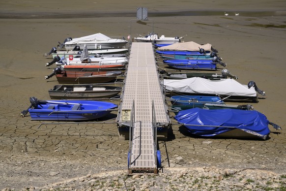 Stranded boats are pictured on the dried out shore of the Brenet Lake (French: Lac des Brenets) part of the Doubs river, a natural border beetwen eastern France and western Switzerland, Monday, July 1 ...