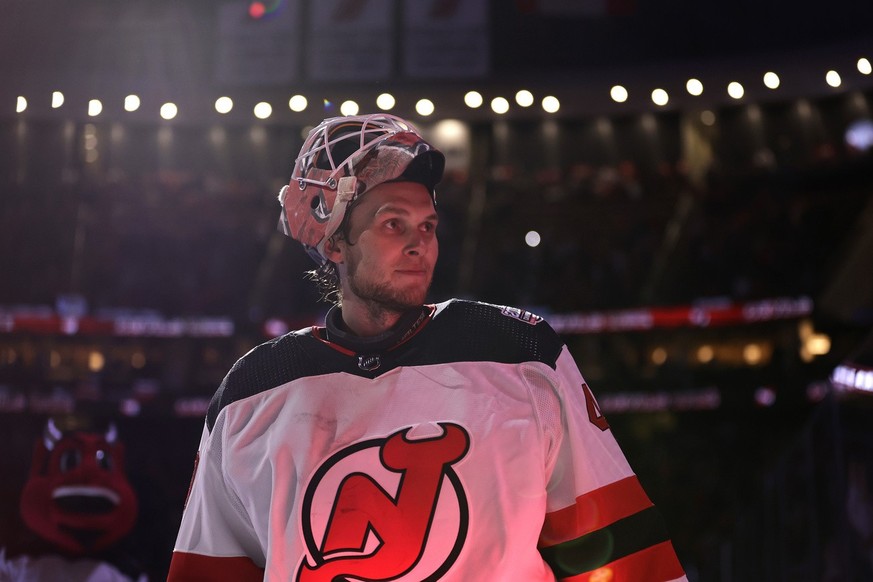 New Jersey Devils goaltender Akira Schmid skates off the ice after being named the second star of the game against the Philadelphia Flyers after an NHL hockey game Saturday, Feb. 25, 2023, in Newark,  ...