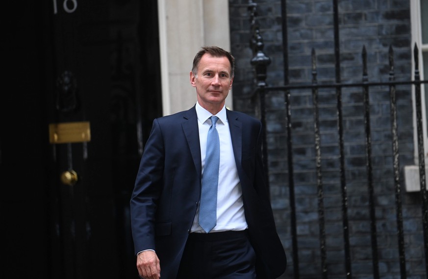 epa10243728 Britain&#039;s newly-appointed Chancellor of the Exchequer Jeremy Hunt departs 10 Downing Street in London, Britain, 14 October 2022. The British prime minister on 14 October 2022 appointe ...