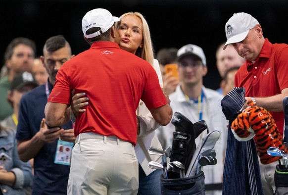 Tiger Woods of Jupiter Links GC gets a hug and kiss from Vanessa Trump before match against Los Angeles Golf Club during the TGL finals at SoFi Center on March 24, 2026, in Palm Beach Gardens, Florida ...