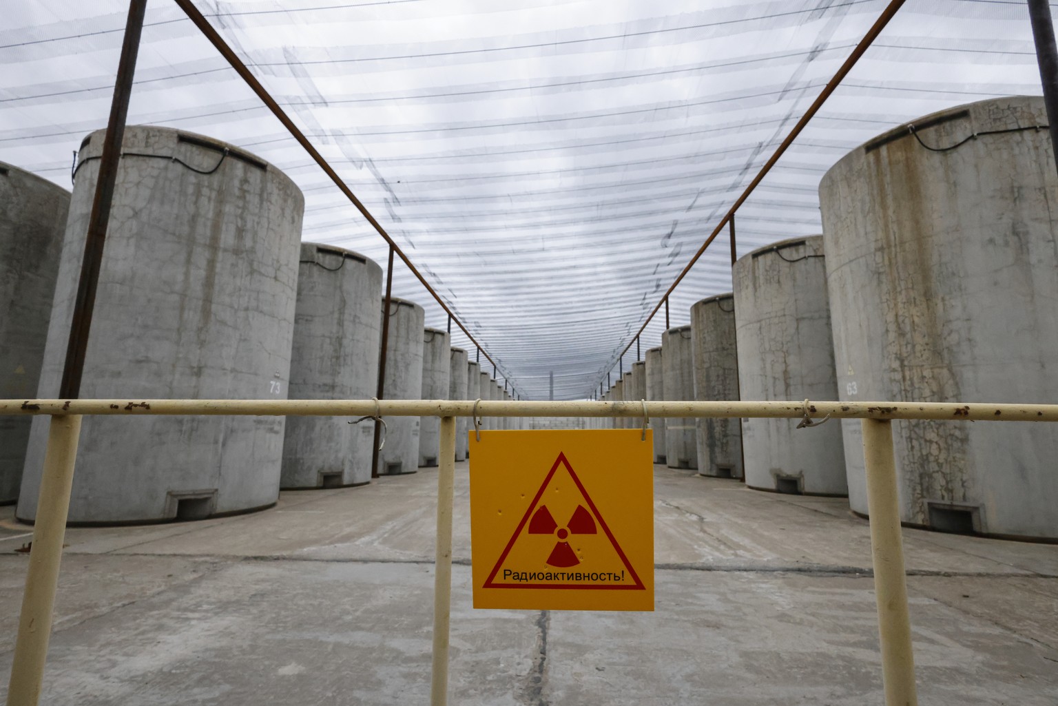 epa10549022 A picture taken during a visit by International Atomic Energy Agency (IAEA) Director-General Rafael Mariano Grossi to Enerhodar organised by the Russian military shows the spent nuclear fu ...