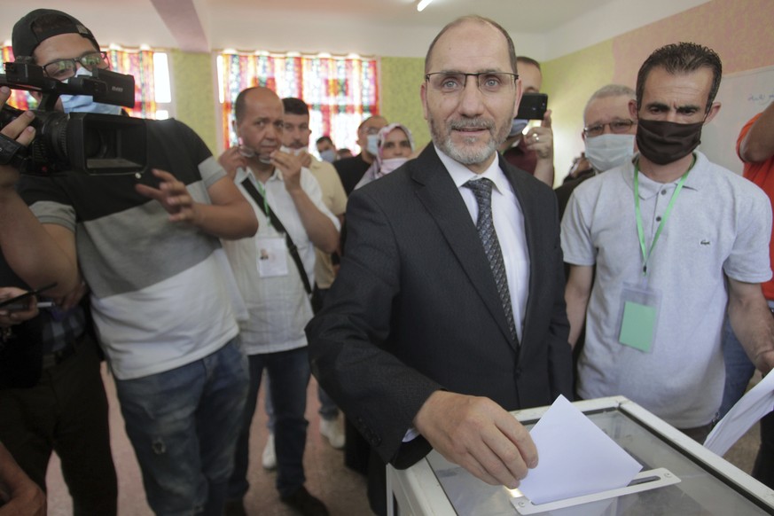 CORRECT SPELLING OF NAME Abderrazak Makri, leader of the Movement for a Peaceful Society casts his vote in a polling station in the country&#039;s first legislative elections sine the ouster of ex-pre ...