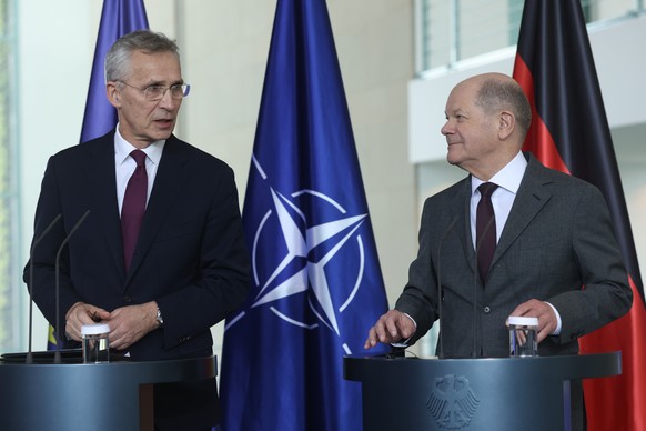epa11302650 NATO Secretary General Jens Stoltenberg (L) and German Chancellor Olaf Scholz look at each other during a joint press statement in Berlin, Germany, 26 April 2024. Stoltenberg is on a two-d ...