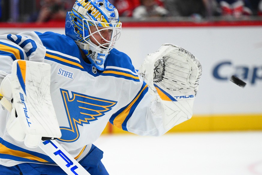St. Louis Blues goaltender Jordan Binnington (50) stops a puck during the first period of an NHL hockey game against the Washington Capitals, Wednesday, Nov. 5, 2025, in Washington. (AP Photo/Nick Was ...