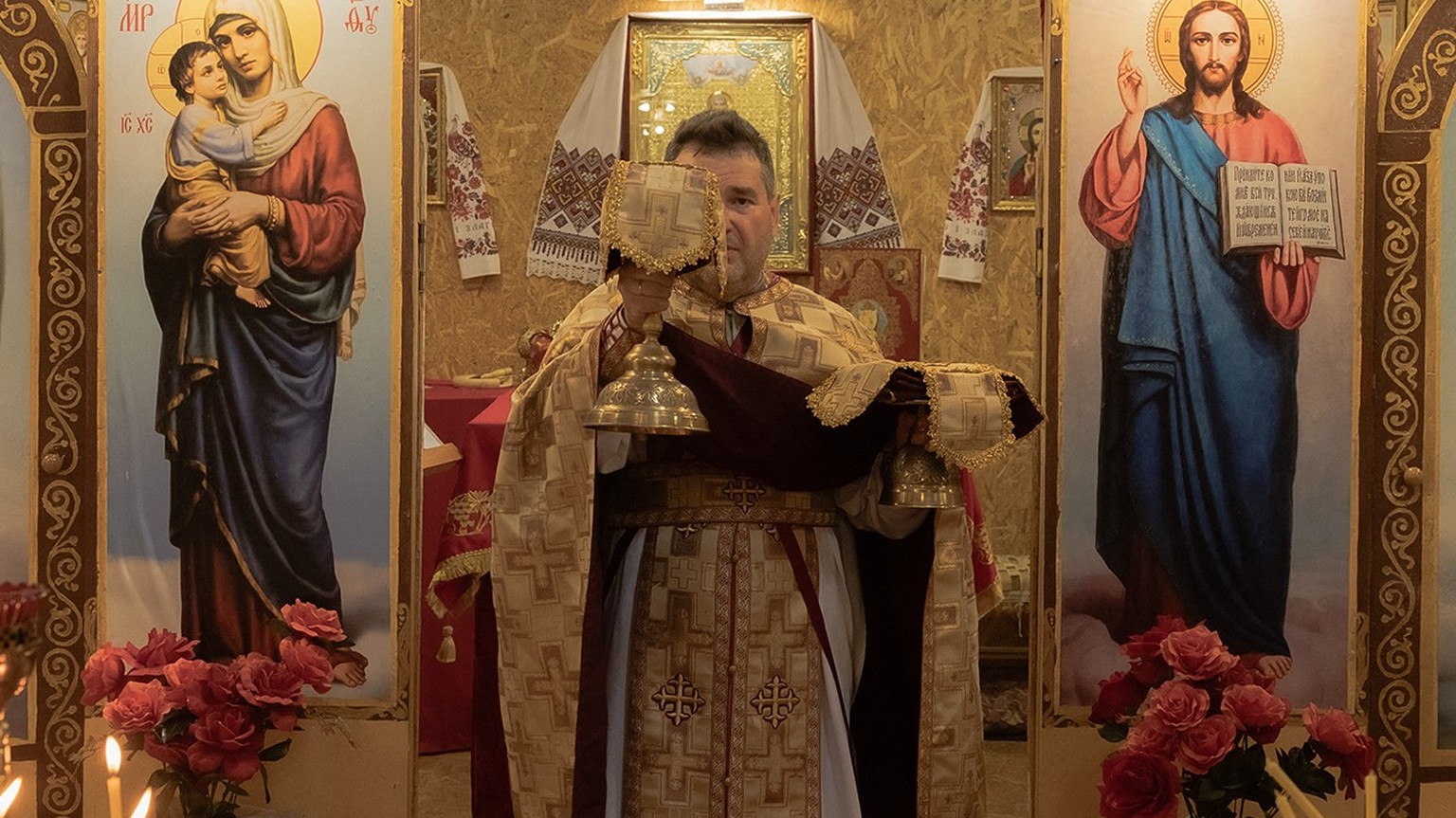 chpriest Oleksandr Tkachuk, 53, leads a prayer service at the Church of the Holy Martyrs Vira, Nadiya, Lyubov, and Mother Sophia of the Orthodox Church of Ukraine, which is aligned with Kyiv, in Krama ...