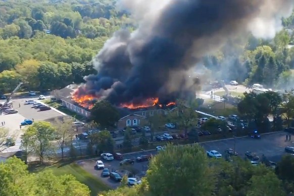 In this image taken from video released by Julie J, @Malkowski6April, Massive flames and smoke rise from The Church of Jesus Christ of Latter-day Saints in Grand Blanc, about 50 miles north of Detroit ...