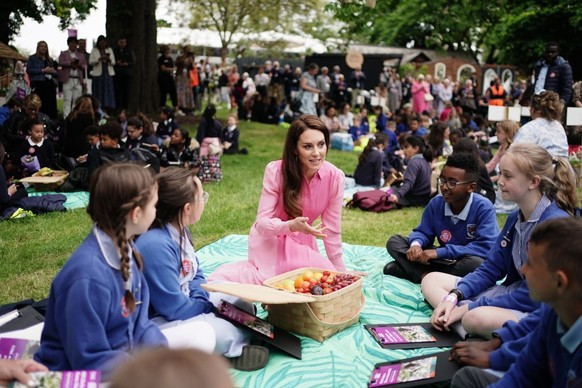 LONDON, ENGLAND - MAY 22: Catherine, Princess of Wales speaks to pupils from schools as she takes part in the first Children&#039;s Picnic at the RHS Chelsea Flower Show, at the Royal Hospital Chelsea ...