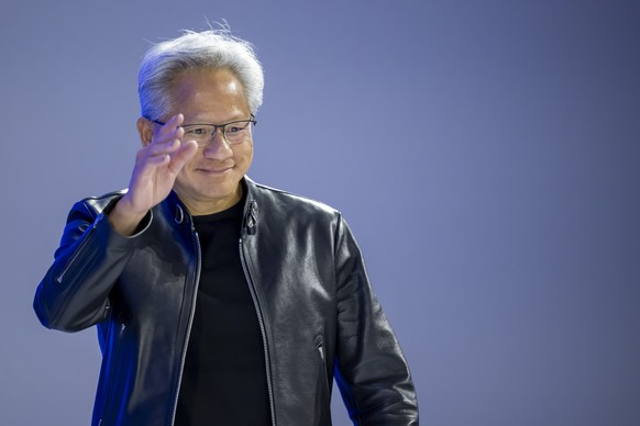 epa12667226 Nvidia founder and CEO Jensen Huang arrives during a panel discussion during the 56th annual meeting of the World Economic Forum (WEF) in Davos, Switzerland, 21 January 2026. The meeting u ...