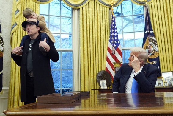 KEYPIX - President Donald Trump listens as Elon Musk, joined by his son X � A-Xii, speaks in the Oval Office at the White House, Tuesday, Feb. 11, 2025, in Washington. (Photo/Alex Brandon)