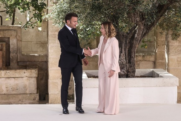 FASANO, ITALY - JUNE 13: Italy's Prime Minister Giorgi Meloni greets President of France Emmanuel Macron during the first day of the G7 meeting at Borgo Egnazia resort, on June 13, 2024 in Fasano ...