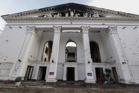 epa10355689 Exterior view of the destroyed Drama Theatre in Mariupol, Ukraine, 08 December 2022. The Mariupol Drama Theater was destroyed on 16 March during Russian airstrikes and the siege of the cit ...