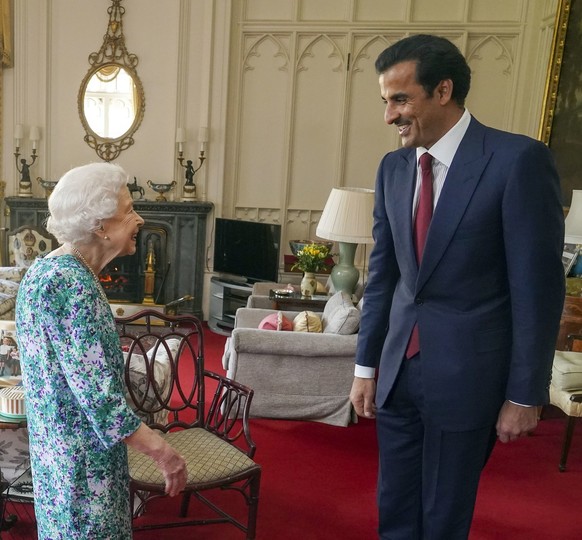 Britain&#039;s Queen Elizabeth II meets with the Emir of Qatar, Sheikh Tamim bin Hamad Al Thani at Windsor Castle, in Windsor, England, Tuesday, May 24, 2022. (Steve Parsons/Pool Photo via AP)