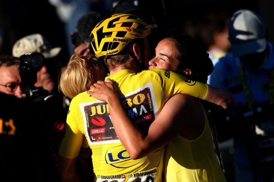 PARIS, FRANCE - JULY 24: Jonas Vingegaard Rasmussen of Denmark and Team Jumbo - Visma - Yellow Leader Jersey celebrates with his daughter Frida and wife Trine Hansen as overall race winner after durin ...