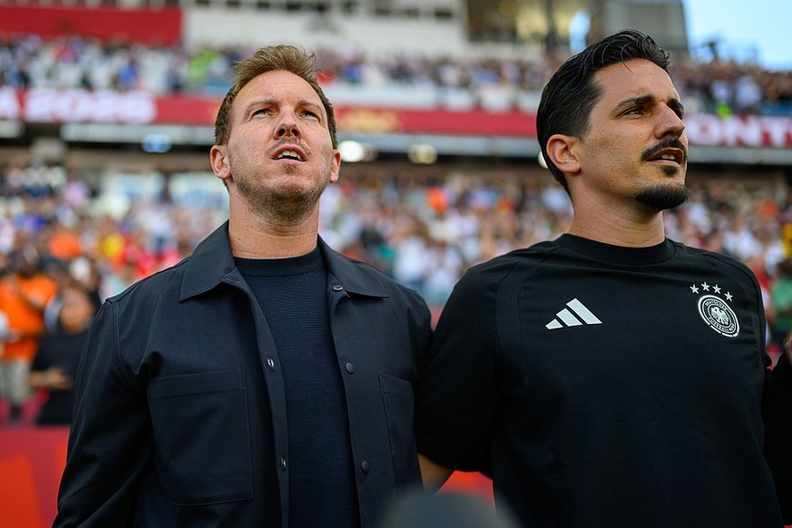 TORONTO, ONTARIO - JUNE 20: Head coach Julian Nagelsmann and assistant coach Benjamin Huebner (L-R) look on prior to the FIFA World Cup 2026 Group E match between Germany and Cote D'Ivoire at Tor ...
