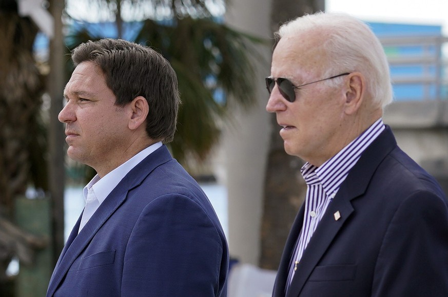 President Joe Biden and Florida Gov. Ron DeSantis arrive to tour an area impacted by Hurricane Ian on Wednesday, Oct. 5, 2022, in Fort Myers Beach, Fla. (AP Photo/Evan Vucci)
Joe Biden,Ron DeSantis