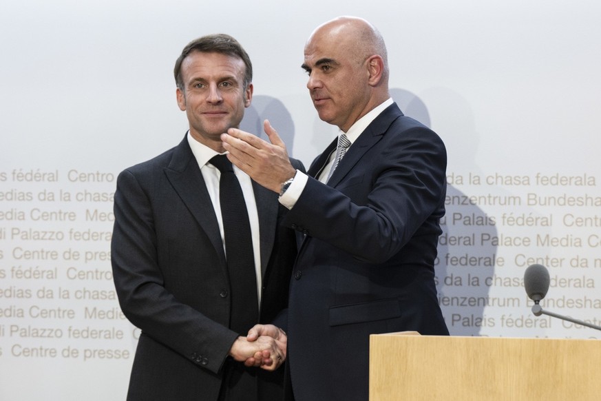 Switzerland's President Alain Berset, right, and French President Emmanuel Macron react during a press conference, in Bern, Switzerland, on Wednesday, November 15, 2023. French President Emanuel ...
