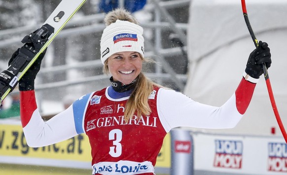 Switzerland&#039;s Corinne Suter celebrates finishing third in the the women&#039;s World Cup downhill ski race in Lake Louise, Alberta, on Saturday, Dec. 4, 2021. (Jeff McIntosh/The Canadian Press vi ...