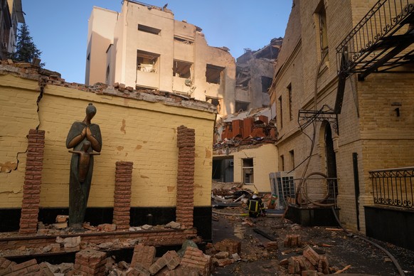 Firefighters work on the scene of a damaged building of the Museum of Chernobyl after a Russian missile attack in Kyiv, Ukraine, Sunday, May 24, 2026. (AP Photo/Efrem Lukatsky)
APTOPIX Russia Ukraine  ...