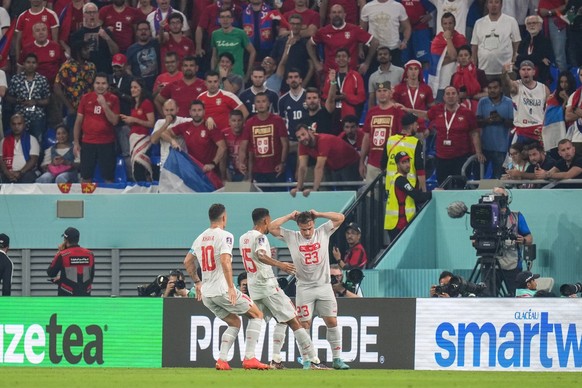Switzerland&#039;s Xherdan Shaqiri, right, celebrates after scoring his side&#039;s opening goal during the World Cup group G soccer match between Serbia and Switzerland, at the Stadium 974 in Doha, Q ...