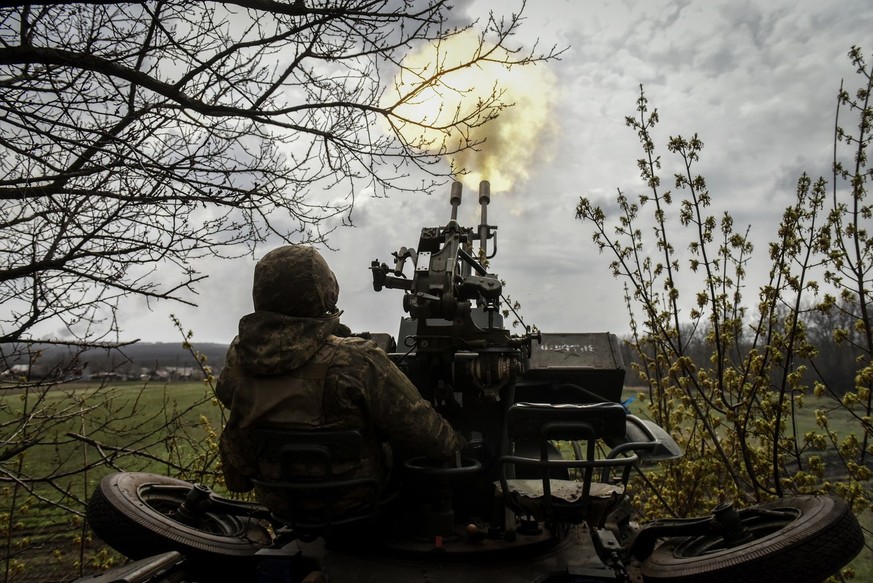 epa10563653 An Ukrainian serviceman of 57th Otaman Kost Hordiienko Separate Motorized Infantry Brigade fires 2s1 &quot;Gvozdyka&quot; self-propelled howitzers at an undisclosed position near the outsk ...