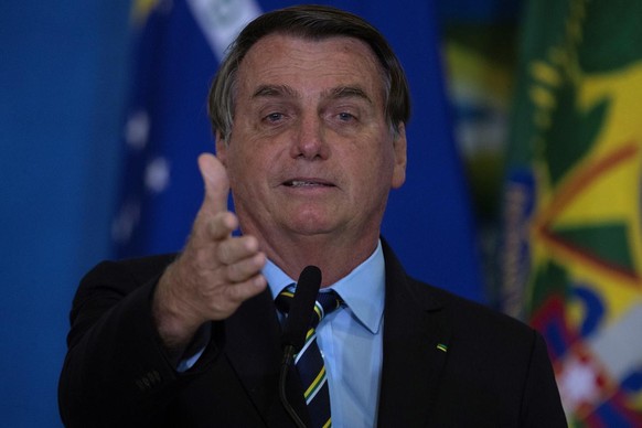 epa09195396 President of Brazil, Jair Bolsonaro, participates in a ceremony of social and environmental actions and adherence to the Adopt a Park program, in Brasilia, Brazil, 12 May 2021. EPA/Joedson ...