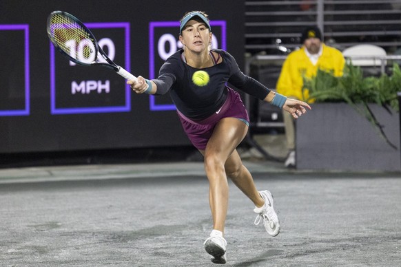 Belinda Bencic, of Switzerland, returns a shot to Jessica Pegula during semifinal action at the Charleston Open tennis tournament in Charleston, S.C., Saturday, April 8, 2023. (AP Photo/Mic Smith)