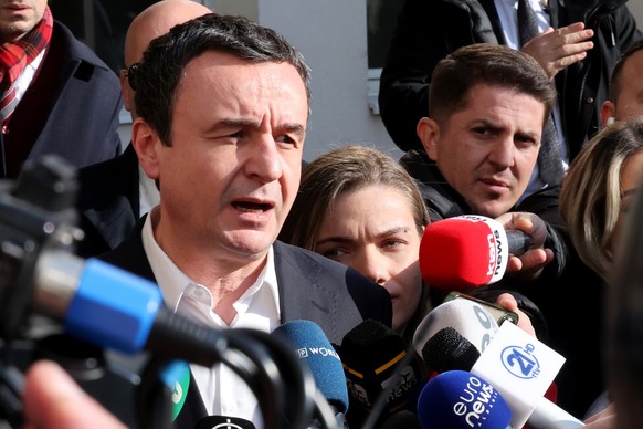 epa11884041 Incumbent Prime Minister and leader of &#039;Vetevendosje&#039; party, Albin Kurti, talks to the media after casting his ballot for the parliamentary elections in Pristina, Kosovo, 09 Febr ...