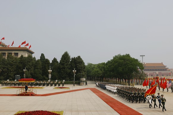 epa12955667 Honour guard members march during the welcome ceremony for U.S. President Donald Trump hosted by Chinese President Xi Jinping at the Great Hall of the People in Beijing, China, 14 May 2026 ...