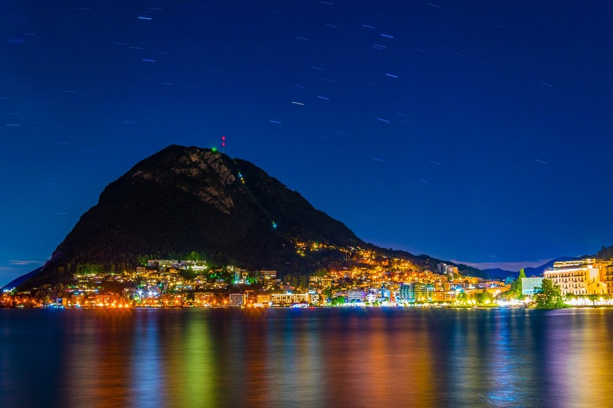 Sunset view of Lugano situated under San Salvatore mountain, Switzerland