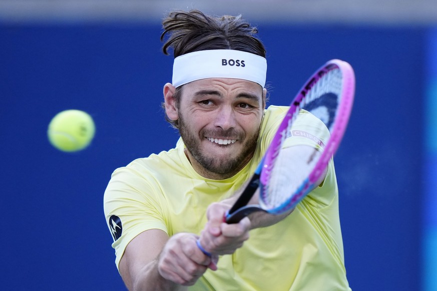 Taylor Fritz, of the United States, returns with a backhand to Gabriel Diallo, of Canada, during their match at the National Bank Open men&#039;s tennis tournament in Toronto, Friday, Aug. 1, 2025. (F ...