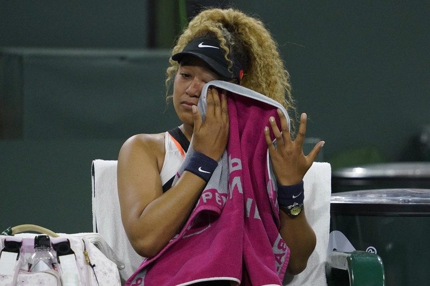 Naomi Osaka, of Japan, reacts to a comment from a spectator during her match against Veronika Kudermetova, of Russia, at the BNP Paribas Open tennis tournament Saturday, March 12, 2022, in Indian Well ...