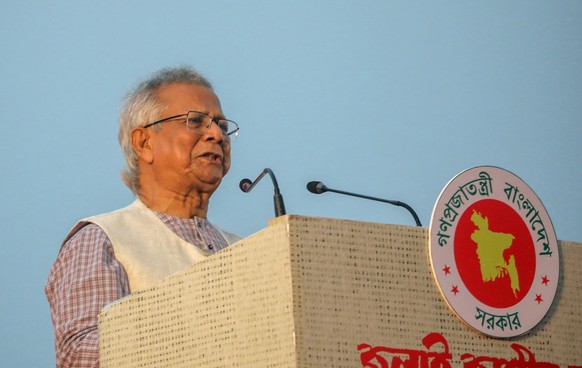 epa12460411 Bangladesh&#039;s interim government chief adviser Muhammad Yunus (C) delivers a speech during the signing ceremony of the &#039;July National Charter&#039; declaration at South Plaza of t ...