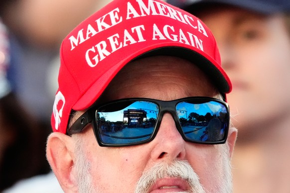 The stage is reflected in the sunglasses of a person attending the opening of the Great American State Fair on the National Mall, Wednesday, June 24, 2026, in Washington. (AP Photo/Jen Golbeck)
Trump  ...