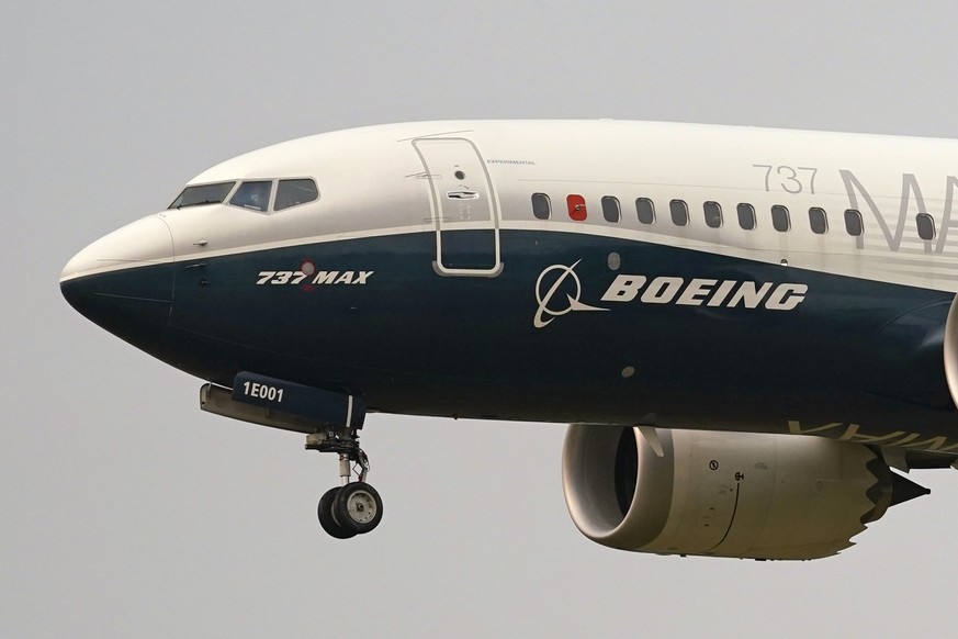FILE - A Boeing 737 Max jet prepares to land at Boeing Field following a test flight in Seattle, Sept. 30, 2020. Boeing announced plans late Sunday, June 30, 2024, to acquire Spirit AeroSystems for $4 ...