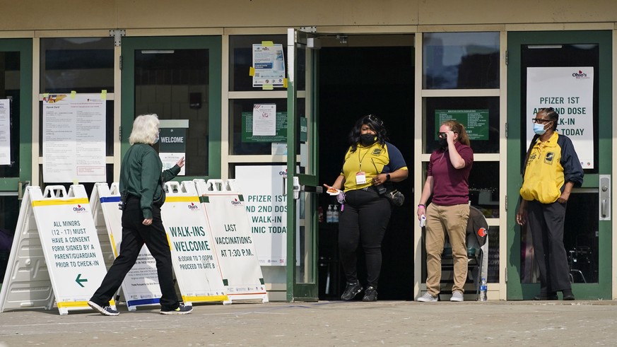 A woman walks into Ohio&#039;s COVID-19 mass vaccination clinic at Cleveland State University, Tuesday, May 25, 2021, in Cleveland. Nearly 2.8 million residents have registered for Ohio&#039;s Vax-a-M ...
