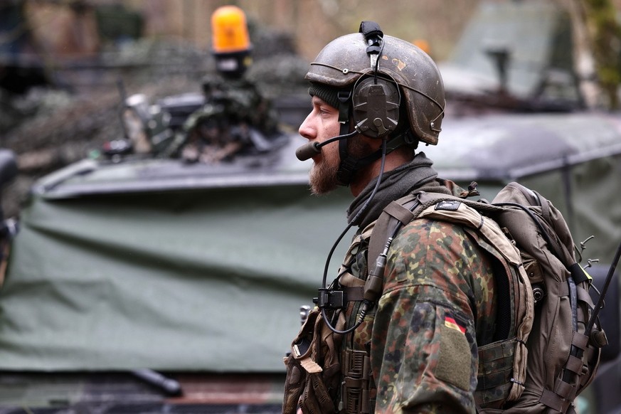 epa11223675 A German soldier looks on during the NATO exercise Allied Spirit 24 in Hohenfels, Germany, 16 March 2024. The US Army, along with NATO Allies and partners hosts Allied Spirit 24 from 26 Fe ...