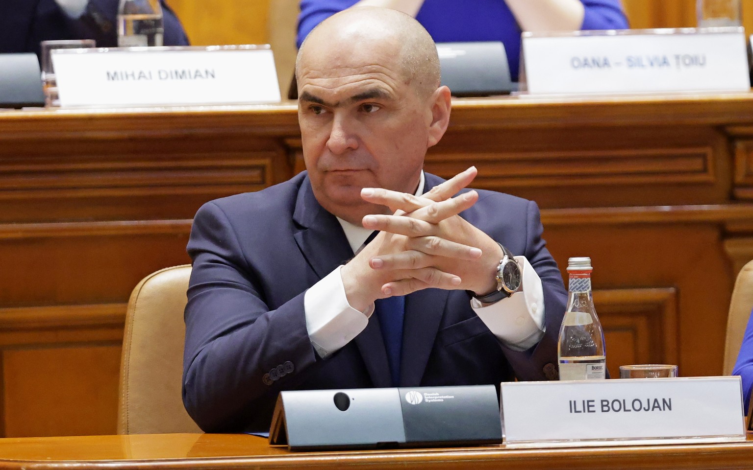 epa12933868 Romania's Prime Minister Ilie Bolojan prepares to deliver his speech before a no-confidence vote on his cabinet during a plenary session of the parliament in Bucharest, Romania, 05 Ma ...