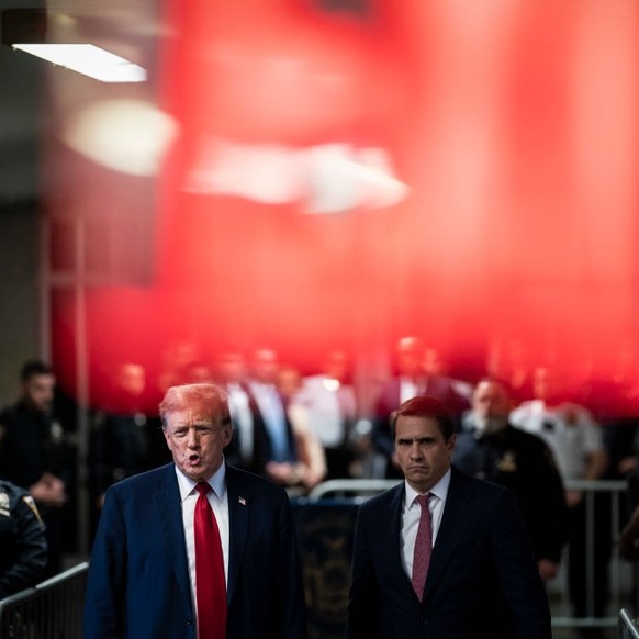 NEW YORK, NEW YORK - APRIL 15: Former U.S. President Donald Trump (L) alongside his attorney Todd Blanche speaks to the media outside the courtroom following the first day of jury selection at Manhatt ...