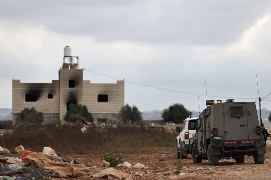 epa13270858 Israeli military vehicles patrol near houses in the West Bank village of Jalud, south of Nablus, 29 September 2026. According to the Palestinian news agency Wafa, Israeli settlers attacked ...