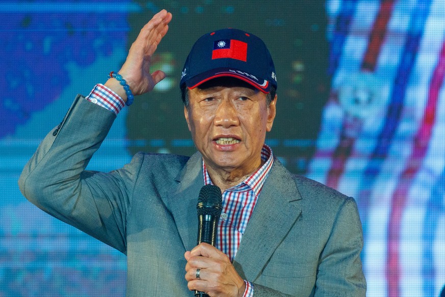 epa10622713 Foxconn founder Terry Gou speaks to a rally as he seek the presidential nomination of the Kuomintang (KMT) in New Taipei City, Taiwan, 12 May 2023. The Foxconn founder promised at his rall ...
