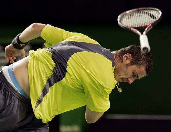 Russia&#039;s Marat Safin throws his racket in frustration during his first round match against Germany&#039;s Benjamin Becker at the Australian Open tennis tournament in Melbourne on Monday, Jan. 15, ...