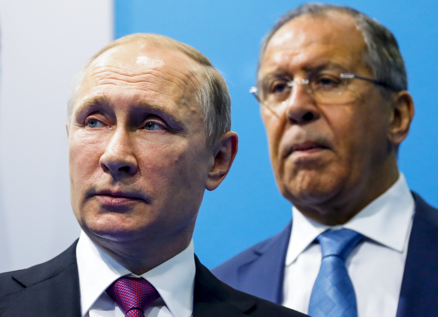 FILE - Russian President Vladimir Putin, left, and Foreign Minister Sergey Lavrov stand while waiting for Turkish President Recep Tayyip Erdogan prior to their talks at the G-20 summit in Hamburg, nor ...