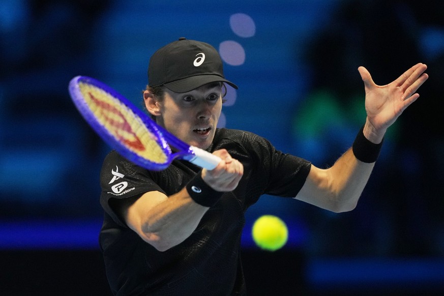 Australia&#039;s Alex de Minaur returns the ball to United States&#039; Taylor Fritz during their tennis match of the ATP World Tour Finals, in Turin, Italy, Thursday, Nov. 13, 2025. (AP Photo/Antonio ...